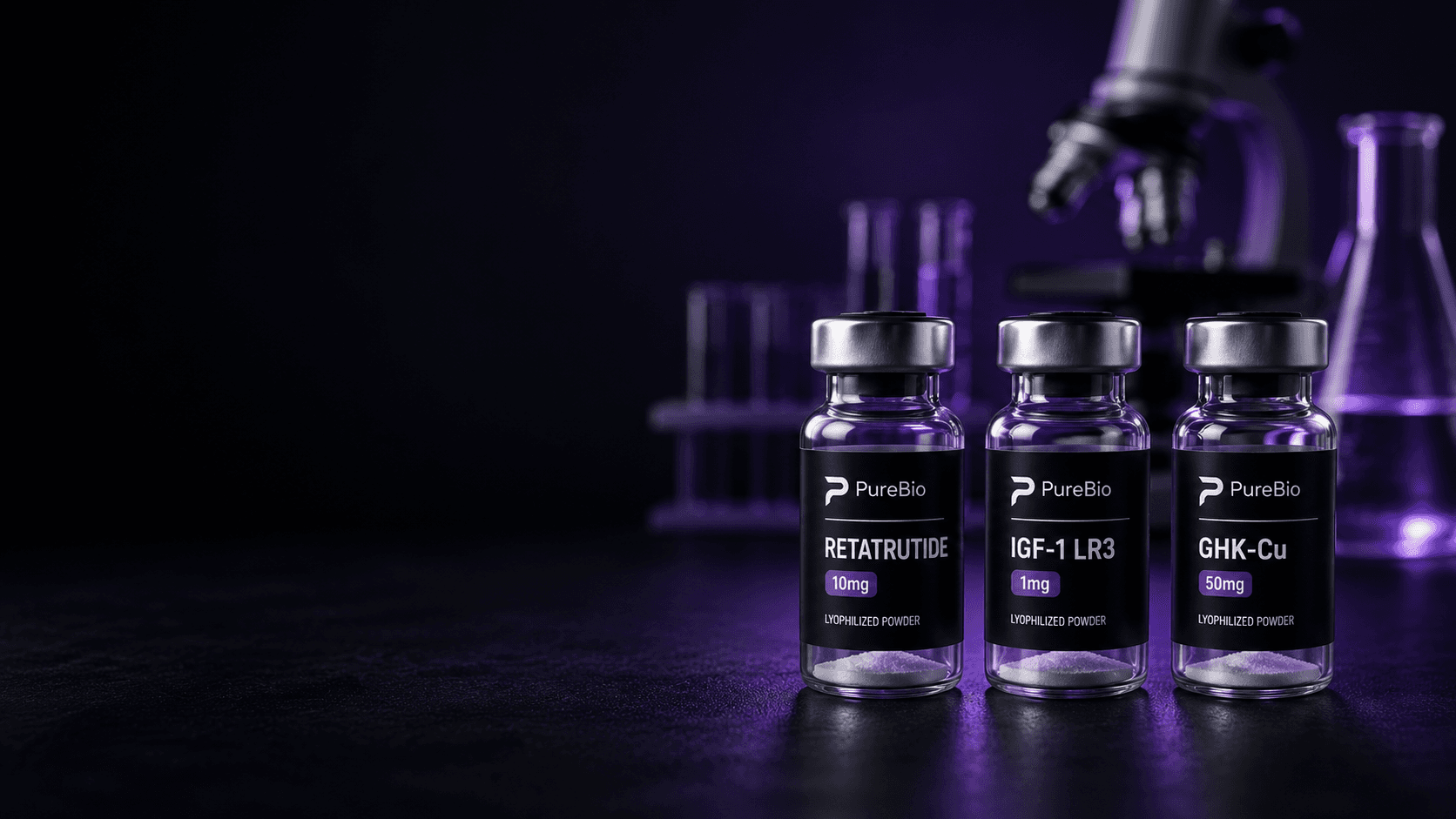 Three lyophilized peptide vials on a laboratory bench beside a microscope